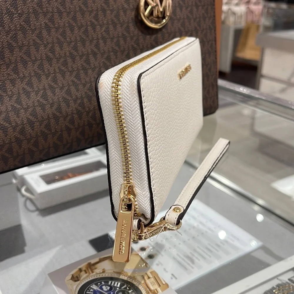 MICHAEL KORS LARGE TRAVEL CONTINENTAL WRISTLET WALLET OPTIC WHITE COLOR
